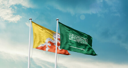 Bhutan and Saudi Arabia friendship flags are waving in the sky. Two country flag for agreement or...