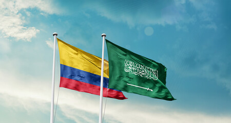 Colombia and Saudi Arabia friendship flags are waving in the sky. Two country flag for agreement or...