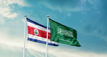 Costa Rica and Saudi Arabia friendship flags are waving in the sky. Two country flag for agreement or deal. Costa Rica KSA national flag for commitment.