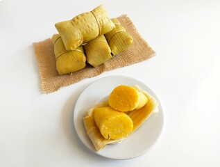 Lepet Jagung is a traditional Indonesian snack that is often found in Central Java, Indonesia, made from corn and grated coconut and wrapped in corn husks and steamed.