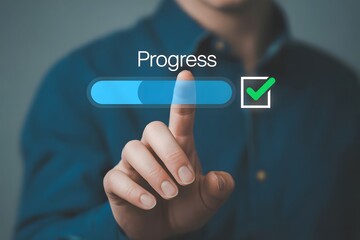 Hand touching a progress bar with a checkmark symbolizing completion achievement and advancement in a project or task with successful results and positive