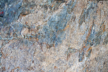 artificial gray rock face with cracks