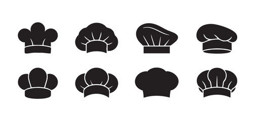 Eight black chef hats arranged in two rows on white background toque blanche chef cap