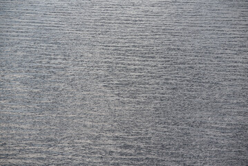 pattern of blue ocean water with small waves