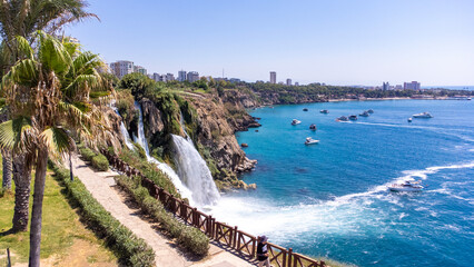 Waterfall Duden (Karpuzkaldiran selalesi) falling into the Mediterranean sea. Waterfall falling into sea. Waterfall stream. Aerial drone shooting. Antalya - Turkey