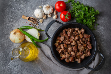 Muslims Traditional Sacrifice holiday food lamb, Turkish roasted meat in copper pot on table top. Turkish Kavurma. (Turkish name; Kurban kavurma)
