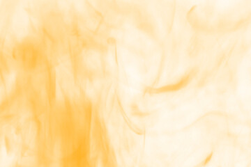 Abstract swirling golden and amber hues create a mesmerizing dance of light and shadow evoking warmth and mystery in a dynamic visual composition