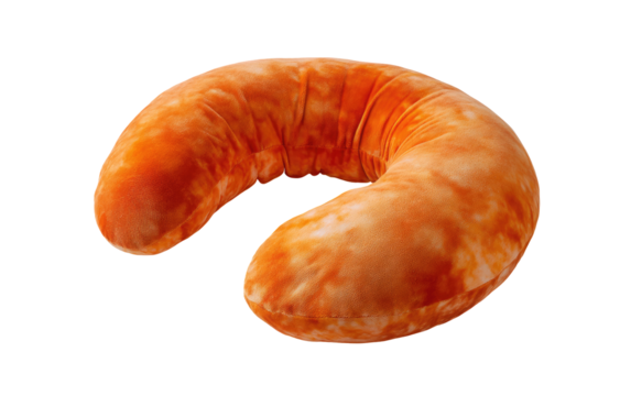 Orange, curved, plush neck pillow.  Isolated on black