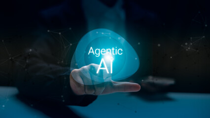 Futuristic hand pointing to glowing Agentic AI hologram, representing artificial intelligence evolution, human-AI interaction, and advanced digital innovation in technology and business.