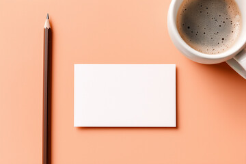 White blank card with brown pencil and coffee cup on peach background white card empty card