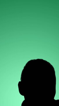 Animation of silhouette of athlete on throwing hammer on green background