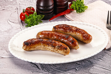 Delicous natural roasted sausages in the plate