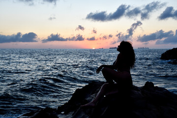 silhouette of a woman on the beach