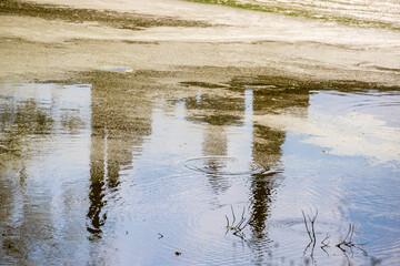 The reflection of a pagoda ,sky,and trees in the lotus pond.