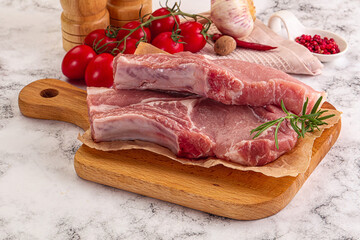 Raw potk loin steak with bone