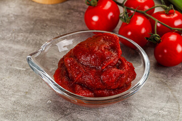 Red tomato paste in the bowl