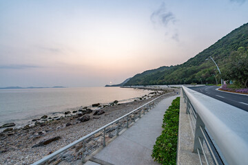 asphalt road side by sea