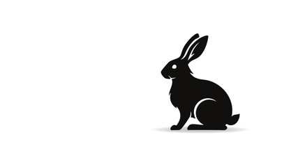 Obraz premium Simple Silhouette of a Sitting Rabbit Showing Its Profile View on a White Background