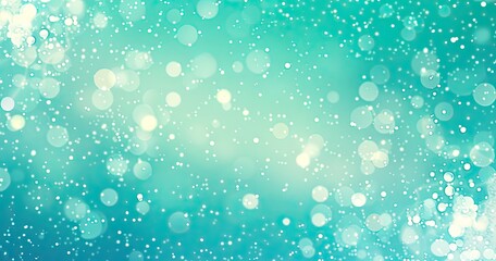 A soft, dreamy background featuring bokeh lights in shades of teal and white.