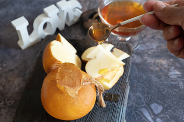 Smoked rennet cheese with honey. Farmer's cheeses of the Caucasus. Top view