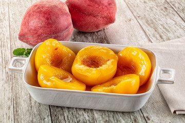 Sweet ripe yellow canned peaches
