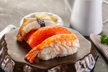 Japanese cuisine - sushi with eel, salmon and prawn