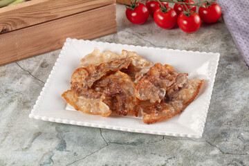Fried crispy pork bacon snack