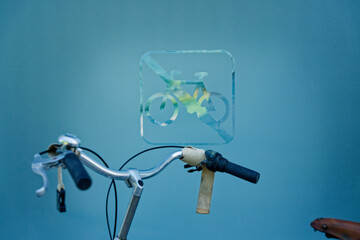 Bicycle handlebar in front of a no-bicycle sign on a frosted glass wall in cph copenhagen