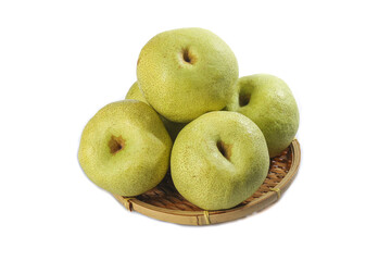 Fresh gunpowder pears displayed on a woven basket against a white background