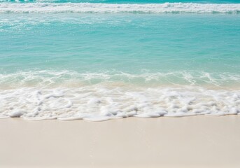 Tranquil beach scene with turquoise water and gentle waves washing ashore