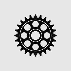 Black Gear Wheel with Holes on a Light Gray Background