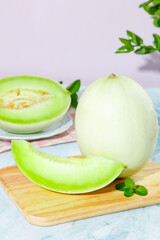 Fresh jade mushrooms, cantaloupe, and honeydew melon displayed together highlighting Shandong's bountiful produce