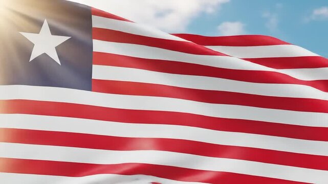 Liberian flag waving proudly against a vibrant blue sky, perfect for national pride videos - Powered by Adobe