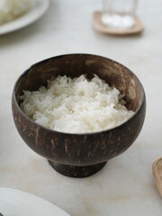 A fresh, healthy bowl of cooked rice, a simple white grain dish, perfect for any meal