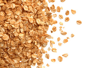 Rolled oats falling on black background healthy breakfast food grain