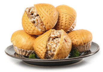 Delicious popped brown sugar walnut buns arranged elegantly on a white background showcasing their sweet and nutty filling