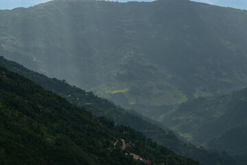 Sun rays falling on Himalayan mountain range, scenic beauty of layers of mountains, Okhrey, sikkim, India. Okhrey village a remote place in Sikkim where mountain range view is enjoyed by tourists.
