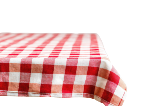 A close-up view of a red and white checkered tablecloth draped over a table, with the edge of the cloth visible.  The fabric is a classic gingham pattern