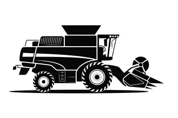 Black silhouette of a modern combine harvester in a field ready for harvest