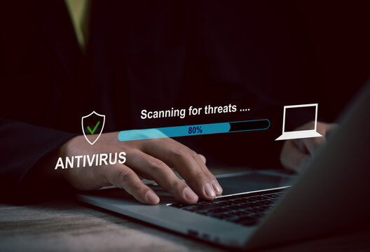 User operating laptop with antivirus scanning interface at 80%, illustrating threat detection, cybersecurity software, malware protection, and digital safety assurance in progress.