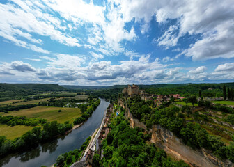 The Château de Beynac, a castle in the commune of Beynac-et-Cazenac, perched on top of a limestone cliff, dominating the town and the north bank of the Dordogne