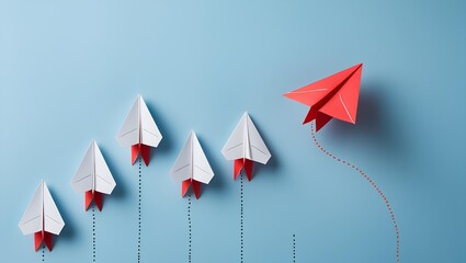 five paper airplanes arranged in a row on a soft blue background 