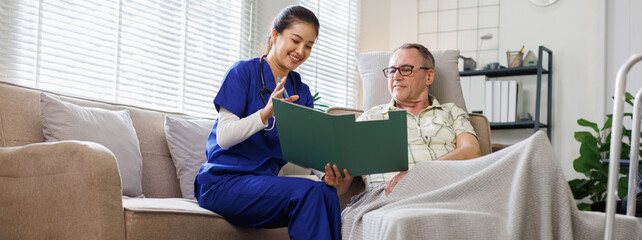Portrait of nurse and her senior man client, senior man listening to counseling caregiver.
