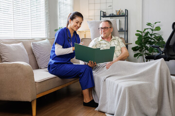 Portrait of nurse and her senior man client, senior man listening to counseling caregiver.
