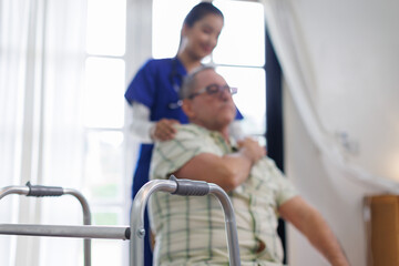 Obraz premium Help, support and wheelchair with nurse and old man for disability, rehabilitation and healing. Retirement, physiotherapy and healthcare with patient and black woman nursing home for medical caregiver