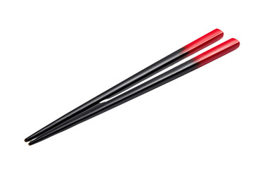 Black chopsticks with red tips angled against black background isolated on a transparent background eating
