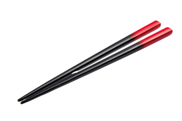 Black chopsticks with red tips angled against black background isolated on a transparent background eating