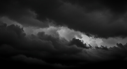 Obraz premium Dramatic dark stormy clouds with a bright light breaking through