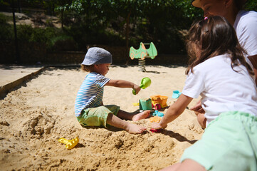 Children Enjoying Playtime Together at a Sunny Outdoor Playground