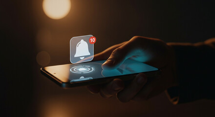 Checking Phone Notifications: Hand Interacting with Smartphone Displaying Bell Icon
